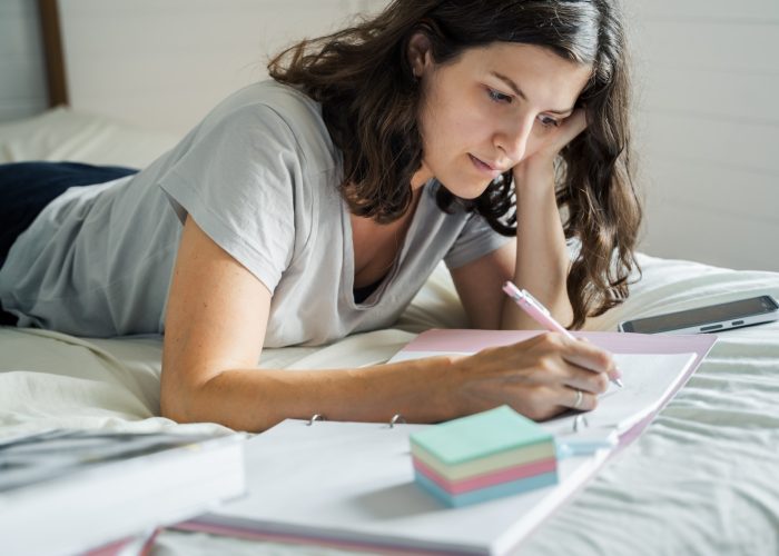 Woman, young girl writes morning pages,takes notes in personal diary of thoughts, mental health. Dra